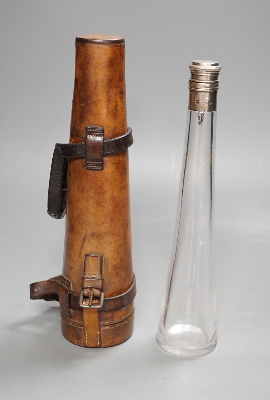 A Victorian silver mounted travelling glass flask in fitted brown leather case